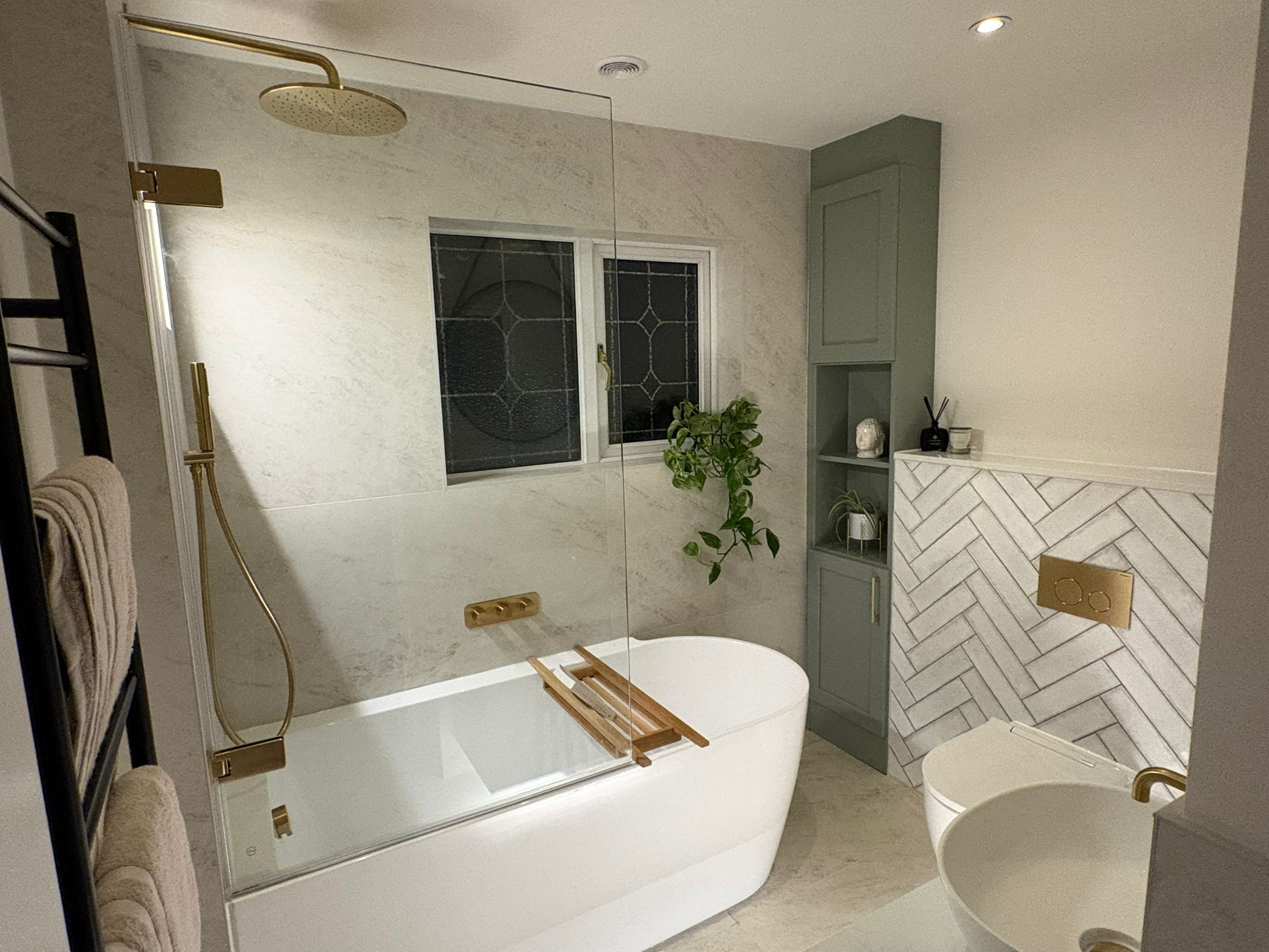 Completed bathroom with a herringbone feature wall